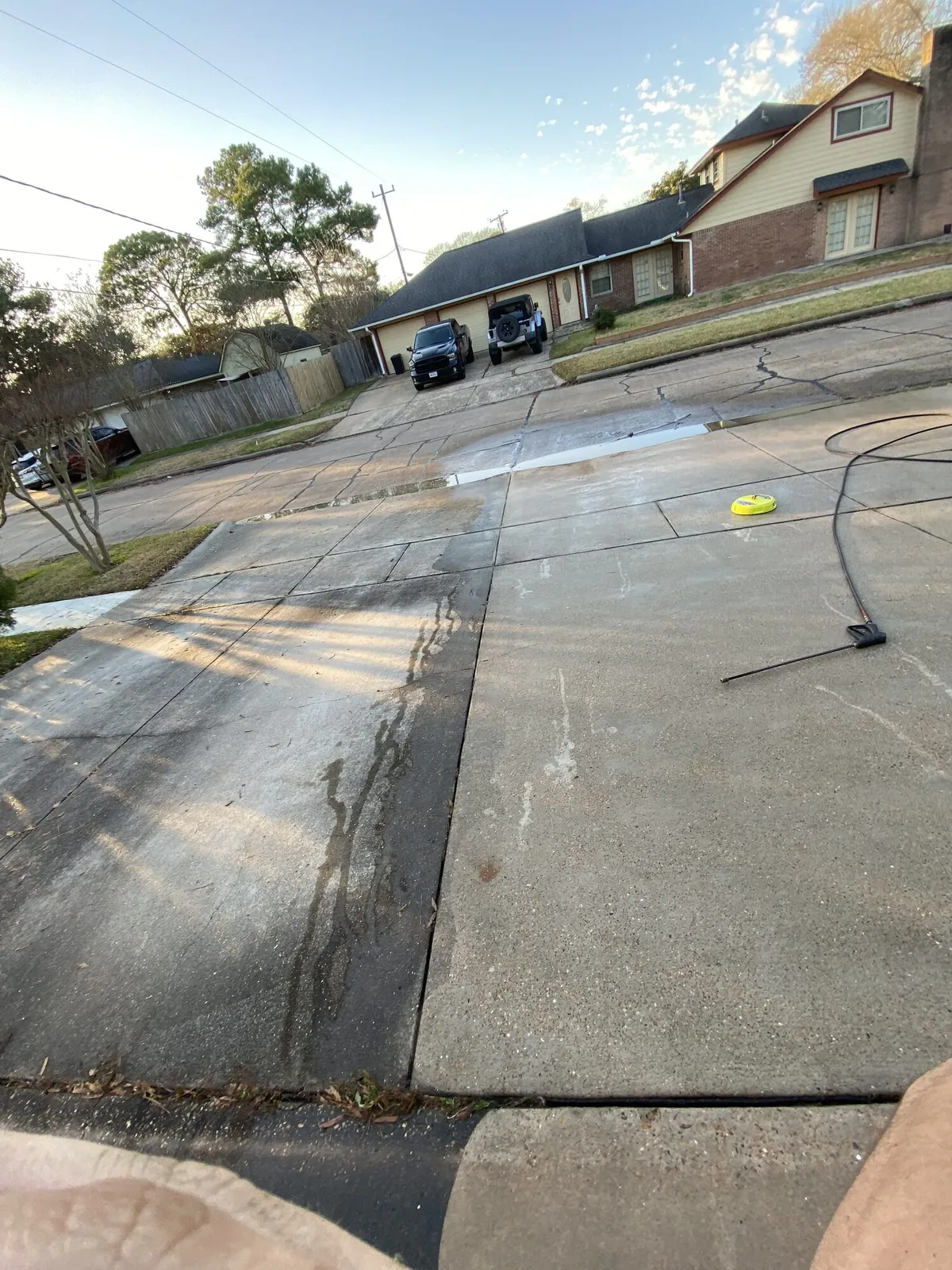 Concrete driveway cleaned with a pressure washer