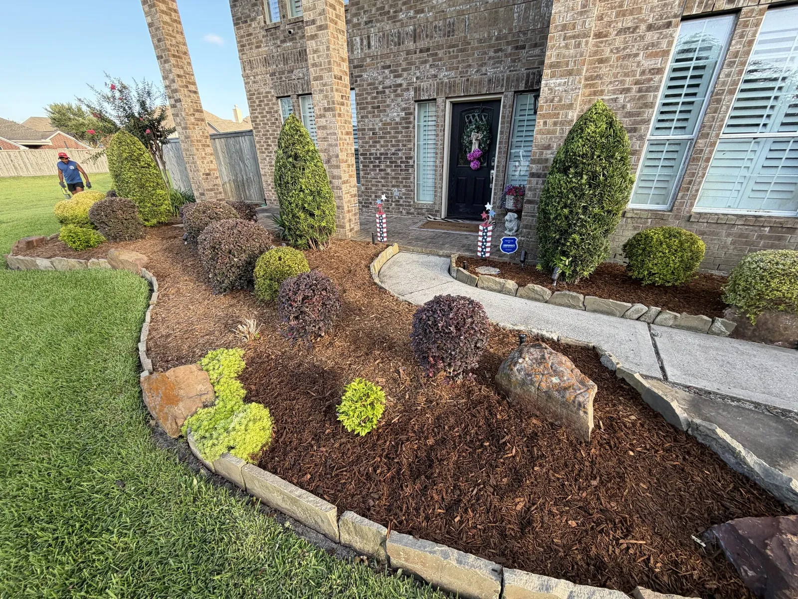 New bed and fresh mulch along a front walkway