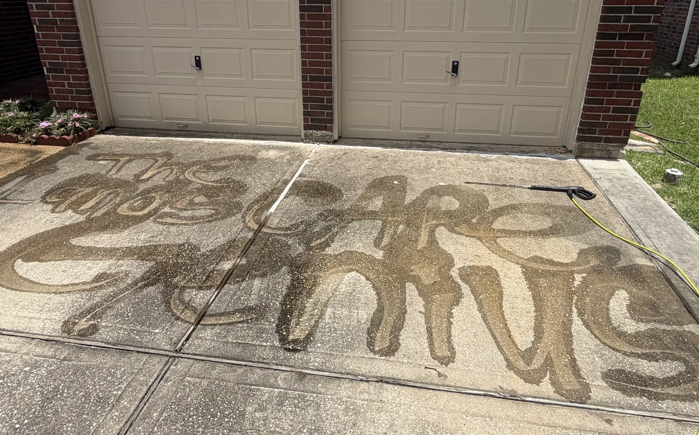 Our name written in the driveway dirt